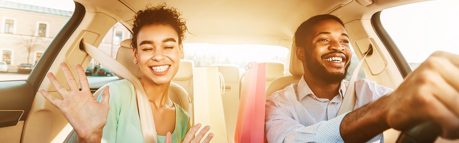 happy couple in new car